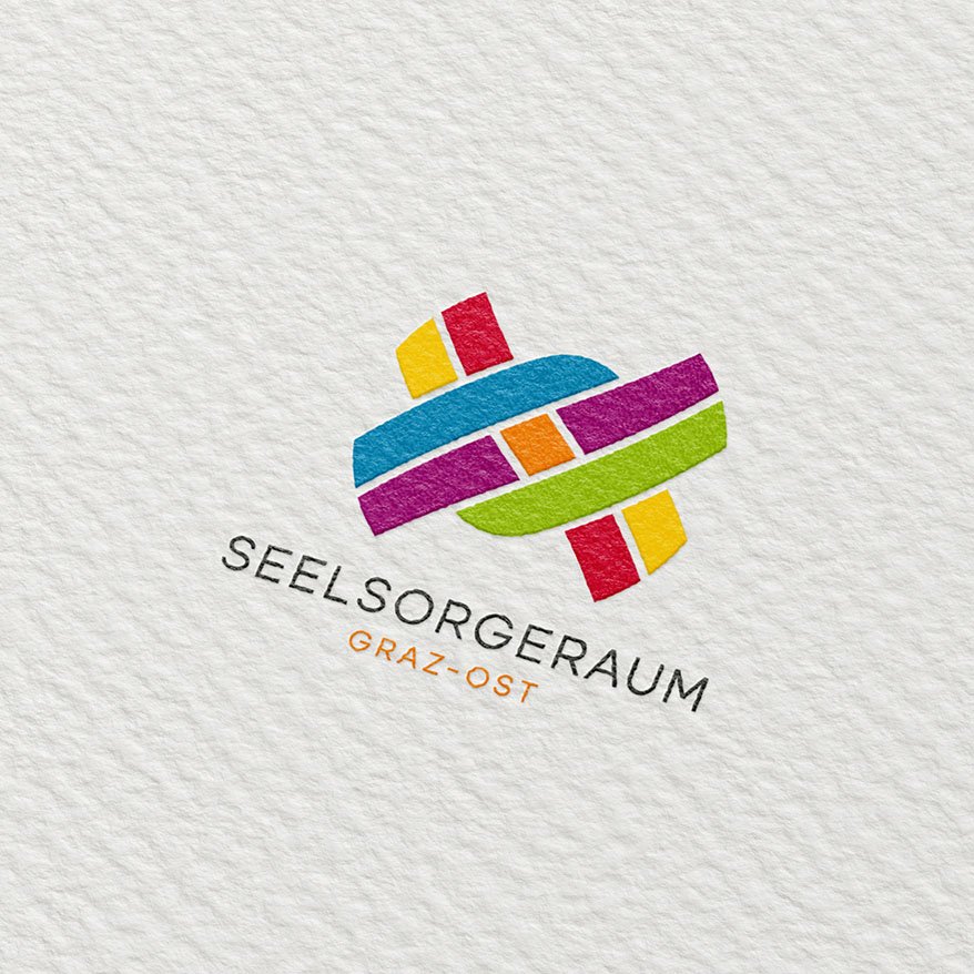Gedrucktes Logo des Seelsorgeraums Graz-Ost in kräftigen Farben auf strukturiertem Papier.